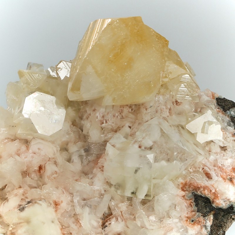 Powellite On Apophyllite With Hematite Inclusions