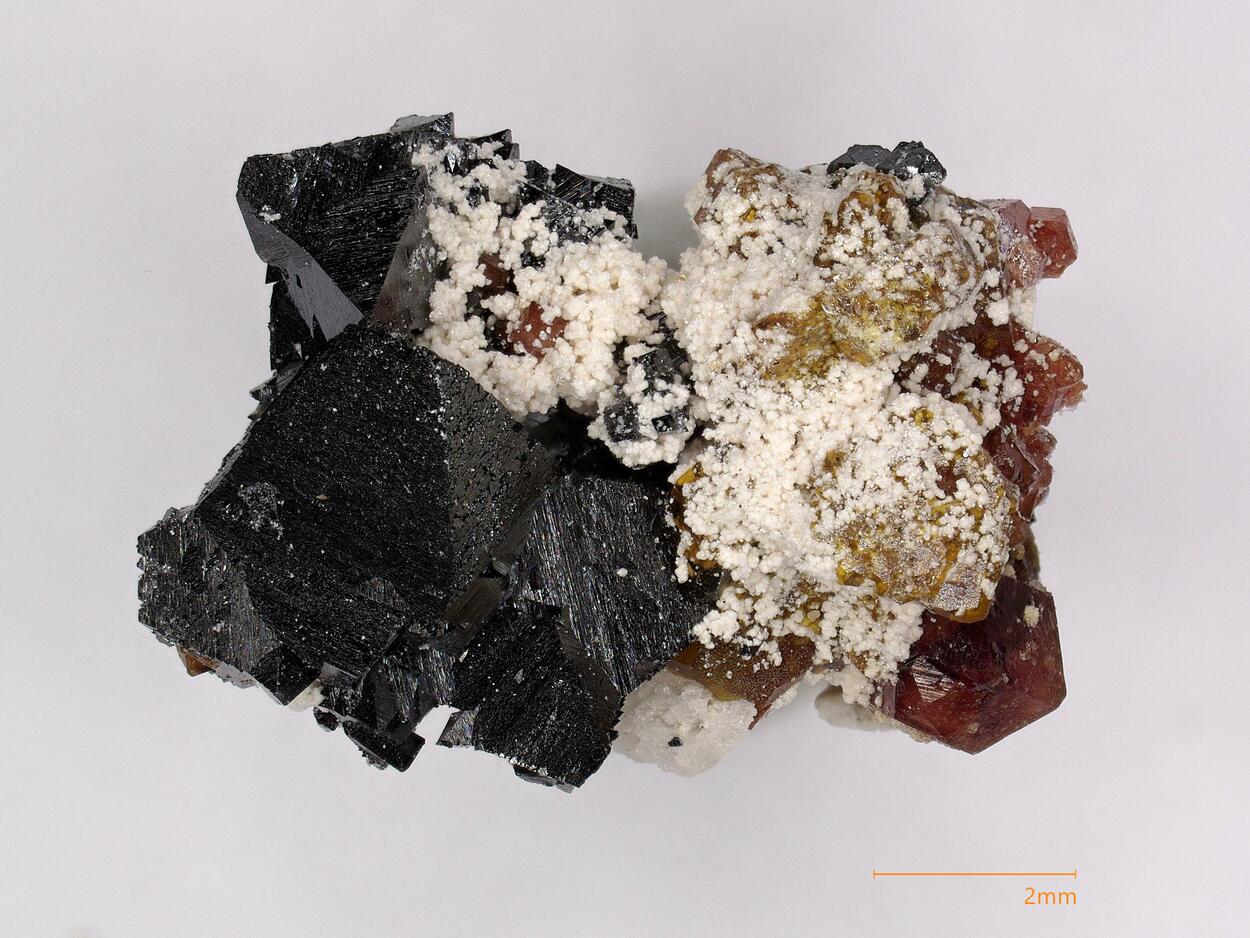 Despujolsite & Hausmannite & Andradite & Clinochlore