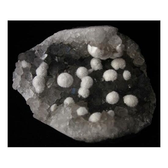 Okenite On Quartz