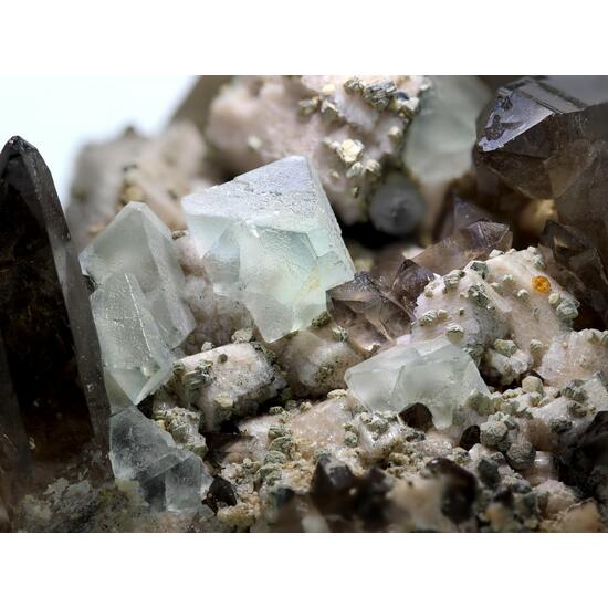 Fluorite On Orthoclase With Smoky Quartz & Spessartine